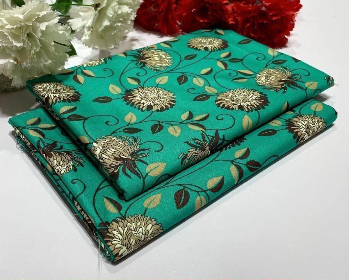2 piece suit in  turquoise swatches with gold floral patterns 