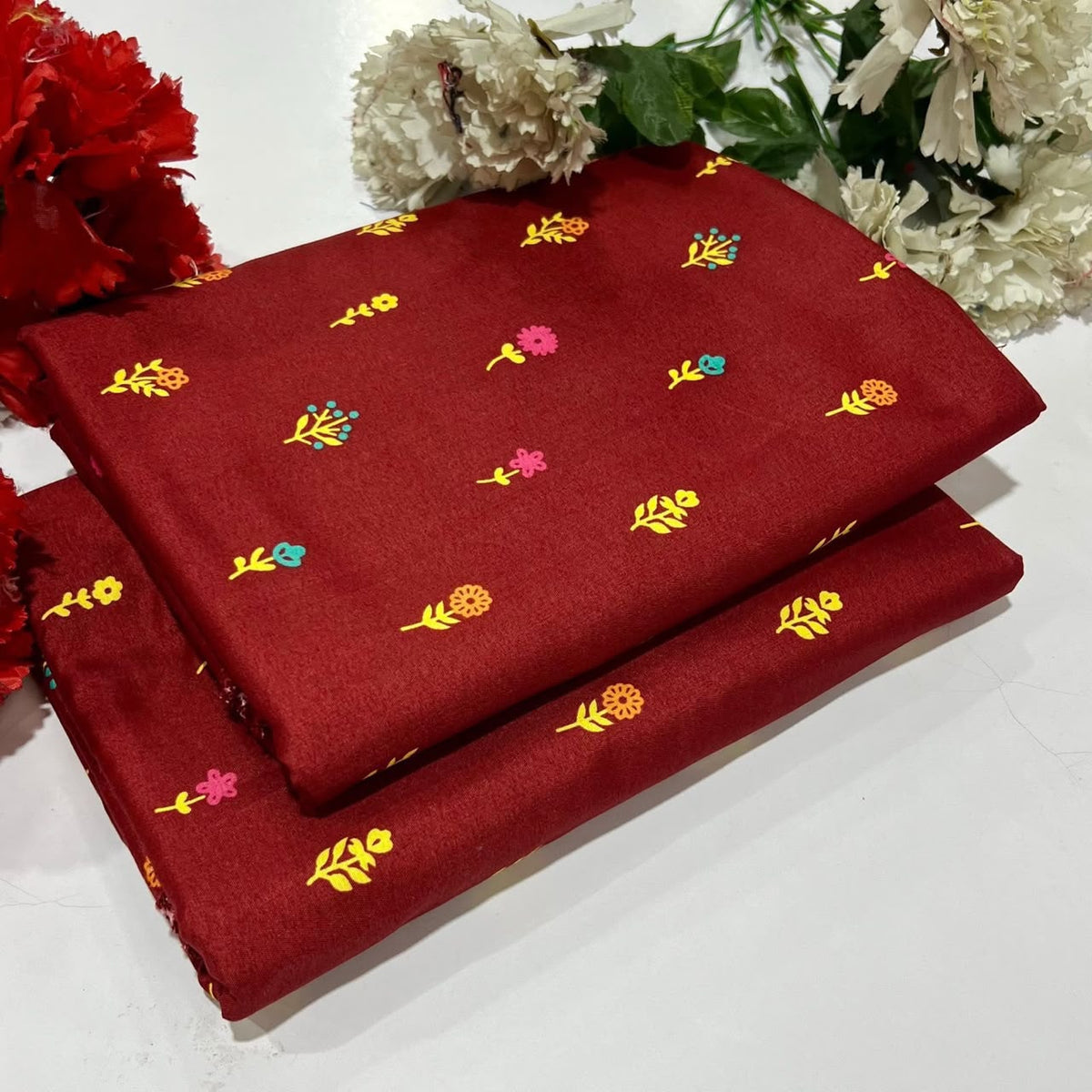 2 piece suit in  red with floral pattern in multi