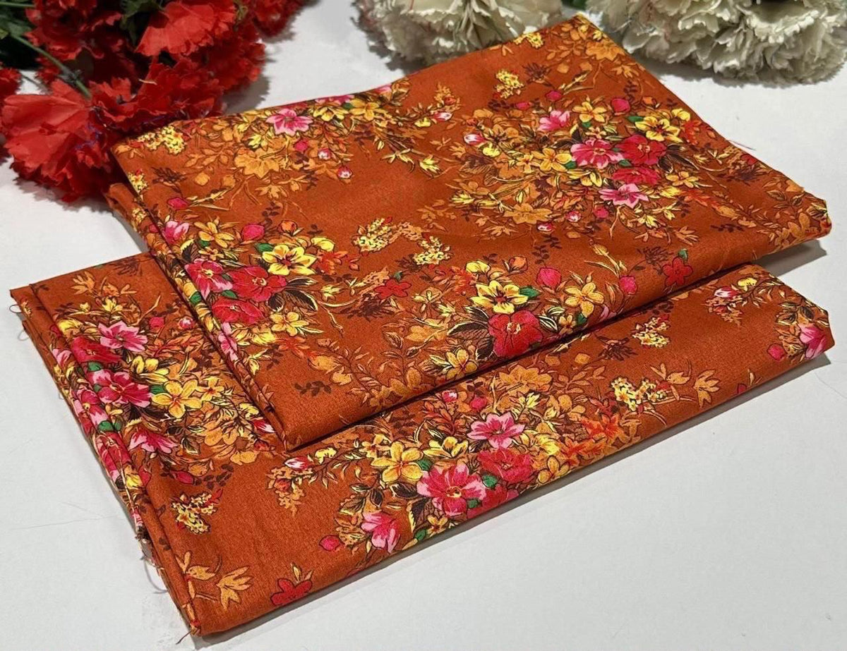2 piece suit in orange with red, pink, and yellow flowers